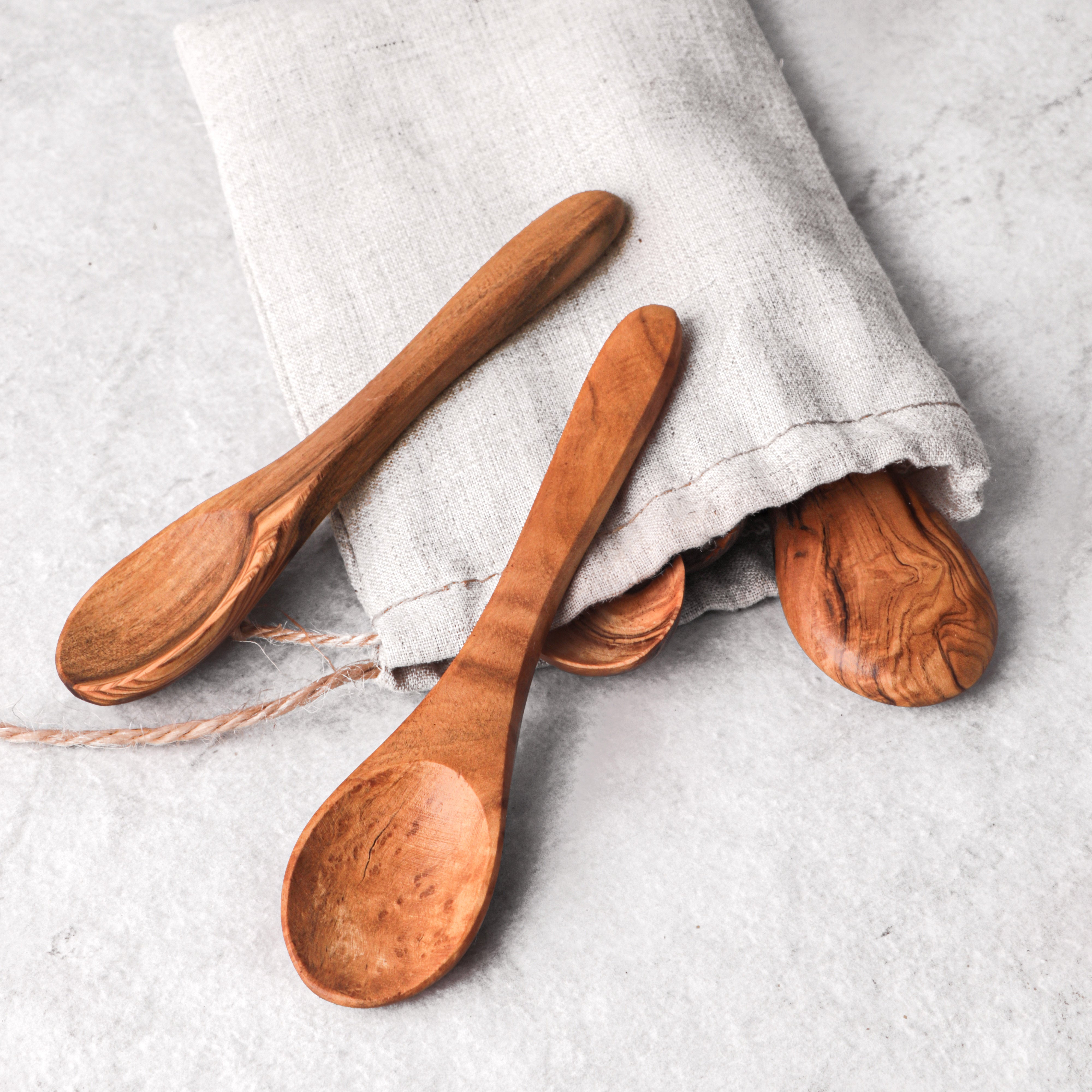 Artisan-crafted small olive wood spoon, perfect as a mini wooden spoon for coffee  and gourmet lovers. Its unique grain and durable design make it a sophisticated addition to your morning ritual, blending functionality with the natural charm of olive wood.